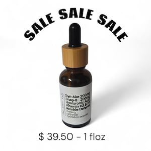 May include: A brown glass bottle with a black dropper and a bamboo cap. The bottle has a white label with text including "Syn-Ake", "Snap-8", and "Wrinkle Defense". The word "SALE" is arched above the bottle.