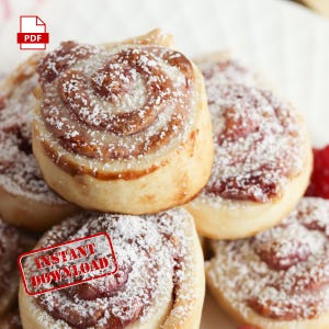 Peut inclure: Gros plan sur une pile de petits pains sucrés à la garniture rose et saupoudrés de sucre glace. Les petits pains sont sur une surface blanche avec un tampon rouge qui dit "INSTANT DOWNLOAD".