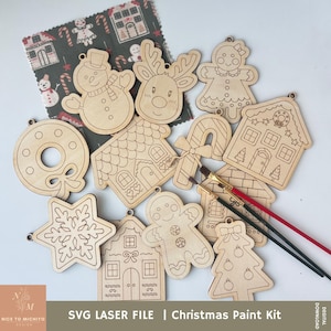 Puede incluir: Un conjunto de 10 adornos navideños de madera sin terminar, que incluyen una casa de jengibre, un muñeco de nieve, un reno, un bastón de caramelo, una estrella, un hombre de jengibre, un árbol de Navidad, una corona, una casa de jengibre y una persona de jengibre. Los adornos están listos para ser pintados.