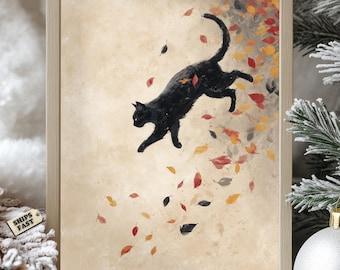 May include: A framed art print featuring a black cat leaping through falling autumn leaves. The artwork has a warm, neutral background with colorful leaves in shades of red, orange, and yellow. The cat is silhouetted against the leaves.