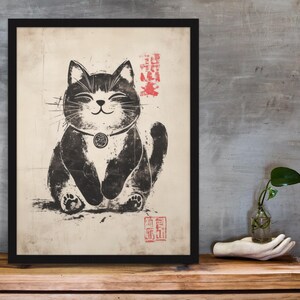 Ink wash illustration of a chubby smiling cat medallion necklace and authentic Japanese stamp accents.