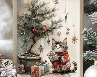 May include: Watercolor painting of a cat in a red kimono holding a gift box, standing near a small Christmas tree decorated with ornaments. Presents are at the base of the tree. The artwork is framed in a light wood frame.