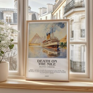 May include: Framed vintage poster of Agatha Christie's "Death on the Nile" featuring a watercolour illustration of a cruise ship on the Nile, with pyramids in the background. The poster includes the year 1937.