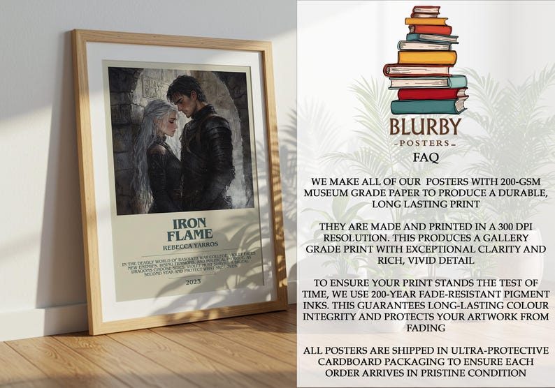 May include: Framed poster featuring a watercolor illustration of a man and woman in dark attire, with the text "IRON FLAME" and "REBECCA YARROS" in a tan border. The poster is displayed on a wooden surface.