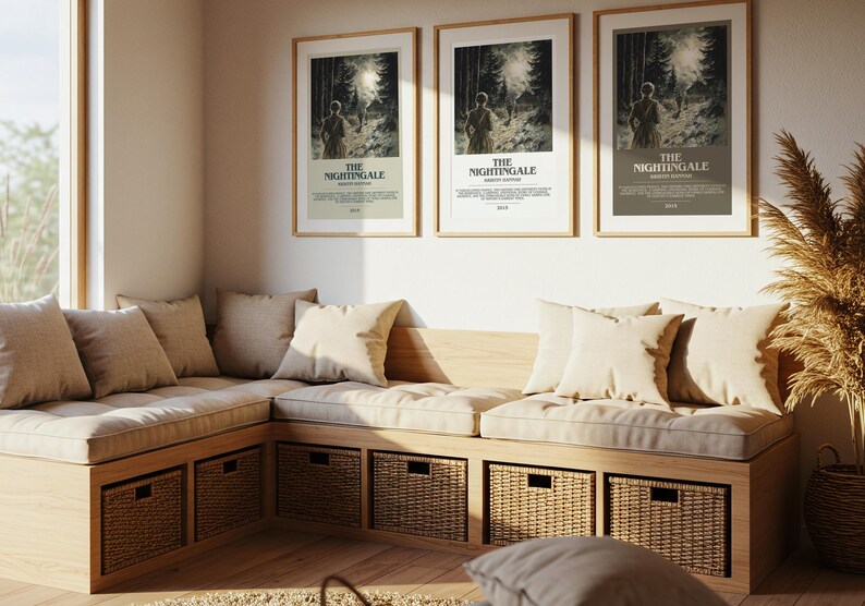 May include: A cozy corner seating area with a wooden frame, beige cushions, and woven storage baskets. Three framed posters with the text "THE NIGHTINGALE" hang above the seating. The room is bathed in natural light.
