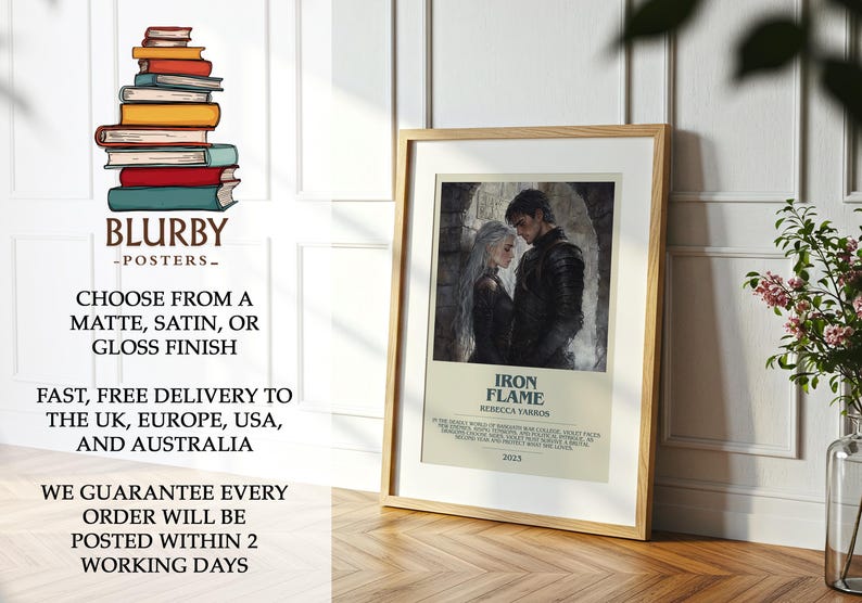 May include: A framed poster featuring a couple from the book "Iron Flame" by Rebecca Yarros. The artwork depicts a man and woman in dark attire, set against a stone background. The poster is in a wooden frame and is displayed on a wooden surface.