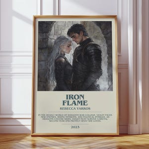 May include: A framed poster featuring a couple in dark attire, with the title "IRON FLAME" and author's name. The poster includes text about a war college, dragons, and survival, with the year 2023.