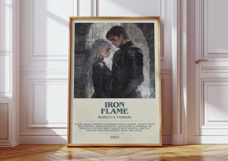 May include: A framed poster featuring a couple in dark attire, with the title "IRON FLAME" and author's name. The poster includes text about a war college, dragons, and survival, with the year 2023.