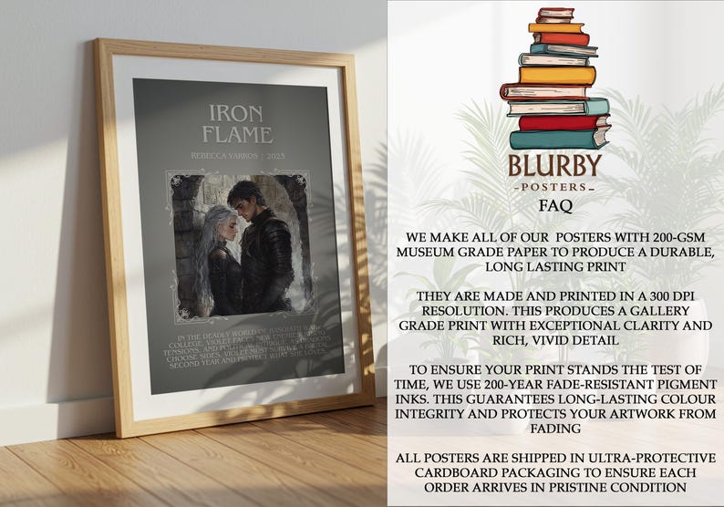 May include: Framed poster titled "Iron Flame" featuring a couple in a romantic embrace. The artwork is set against a gray background with text. The poster is displayed on a wooden floor.