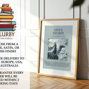 May include: A framed poster with the title "Onyx Storm" and an illustration of a figure and a dragon. The poster is in a light-colored frame and is displayed on a wooden floor. The poster is from Blurbyposters.