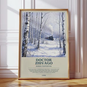 May include: A framed poster featuring a snowy birch forest with a steam train in the distance. The text reads DOCTOR ZHIVAGO, BORIS PASTERNAK, and a summary of the plot, with the year 1958 at the bottom. The print has a light beige background.
