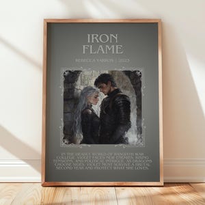 May include: Framed poster with the title "Iron Flame" and author Rebecca Yarros, 2023. The artwork features a couple in dark attire, set against a gray background. Text below describes the story's plot involving war, dragons, and survival.