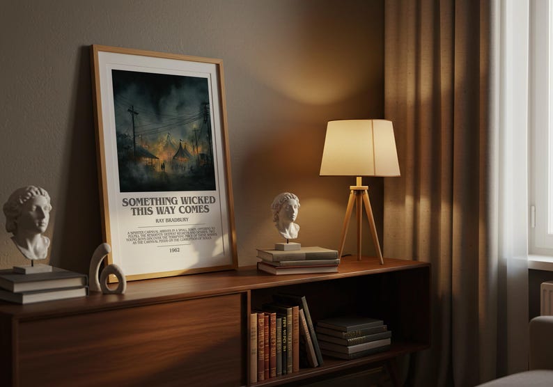 May include: A framed poster with the text "SOMETHING WICKED THIS WAY COMES" by Ray Bradbury. The poster is displayed on a wooden cabinet, alongside a lamp, books, and a bust sculpture. The scene is lit with warm, ambient lighting.