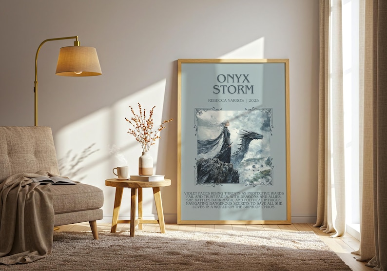 May include: A framed poster with the title "ONYX STORM" and the name "REZZCCA YARBOS | 2025". The artwork depicts a woman and a dragon on a rocky landscape, with text below. The frame is gold.