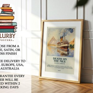 May include: A framed poster depicting a vintage scene of a ship sailing on a river, with pyramids in the background. The poster is titled "Death on the Nile" by Agatha Christie, 1937. The poster is in a wooden frame.
