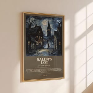 May include: Framed poster featuring a nighttime scene of a town with a church steeple under a full moon. The poster has the title "Salem's Lot" and the author's name, Stephen King. The year 1975 is also printed on the poster.