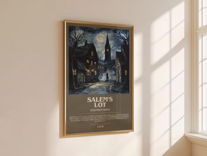 May include: Framed poster featuring a nighttime scene of a town with a church steeple under a full moon. The poster has the title "Salem's Lot" and the author's name, Stephen King. The year 1975 is also printed on the poster.
