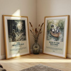 May include: Two framed art prints with wooden frames. One features a woman in a forest with the text "The Nightingale". The other depicts a frog and a rat in a boat with the text "Wind in the Willows". A vase of dried plants sits between them.