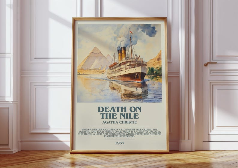 May include: A framed poster with a watercolour painting of a cruise ship on a river, with pyramids in the background. The poster is titled "Death on the Nile" by Agatha Christie, with text below. The poster is in a wooden frame.