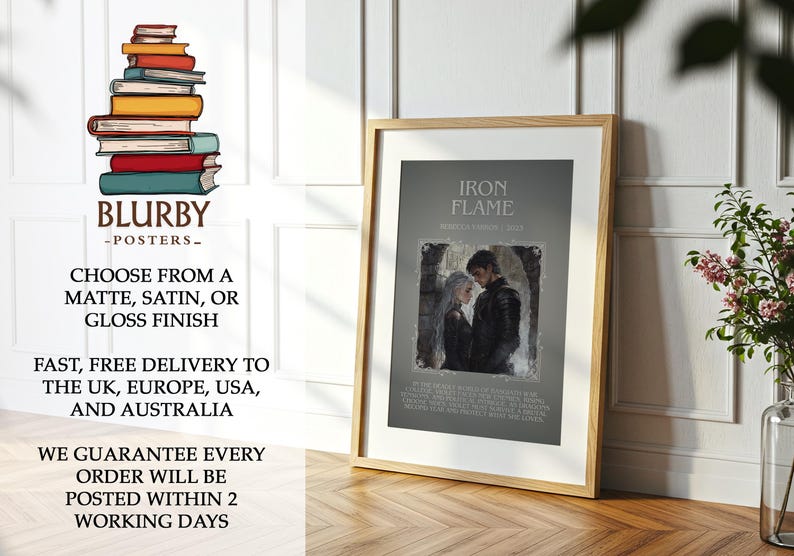May include: A framed poster with the text "IRON FLAME" and an image of a couple. The poster is in a wooden frame and is displayed on a wooden floor. The poster is from "BLURBY - POSTERS-".
