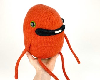 Toots the plush upcycled sweater monster