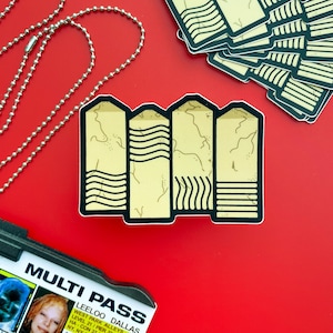 May include: A sticker of a yellow and black multi-pass with the text "MULTI PASS" and "LEELOO DALLAS" on it.