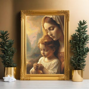 May include: A painting of a mother and child. The mother is wearing a blue robe and holding the child in her arms. The child is wearing a white dress and holding a rosary. The painting is framed in gold.