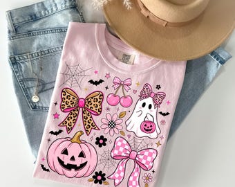 Różowa koszulka z kokardkami i dyniowym duchem na Halloween | Koszulka z kokardką i dyniowym duchem w panterkę, słodka dziewczęca koszulka z upiornym motywem Comfort Colors®