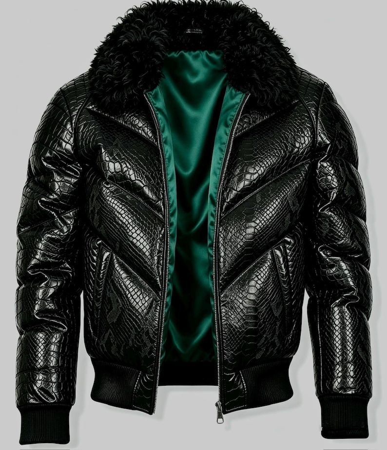 May include: A black puffer jacket featuring a textured snakeskin pattern, a thick black faux fur collar, and a vibrant emerald green satin lining. The jacket includes a front zipper closure, long sleeves with ribbed cuffs, and a ribbed hem.