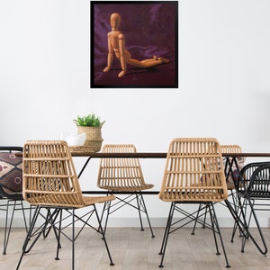 May include: A wooden artist's mannequin posed in a kneeling position on a purple background. The mannequin is made of wood and has a natural finish. The background is a deep purple color.