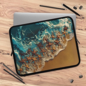 May include: Laptop sleeve featuring a beach scene with starfish. The design shows a sandy shore with foamy waves and numerous starfish in shades of brown and gold. The sleeve has a black border and a zipper.