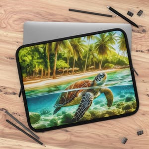 May include: Laptop sleeve featuring a vibrant illustration of a sea turtle swimming in clear turquoise water near a tropical beach with palm trees. The sleeve has a black zipper and trim.