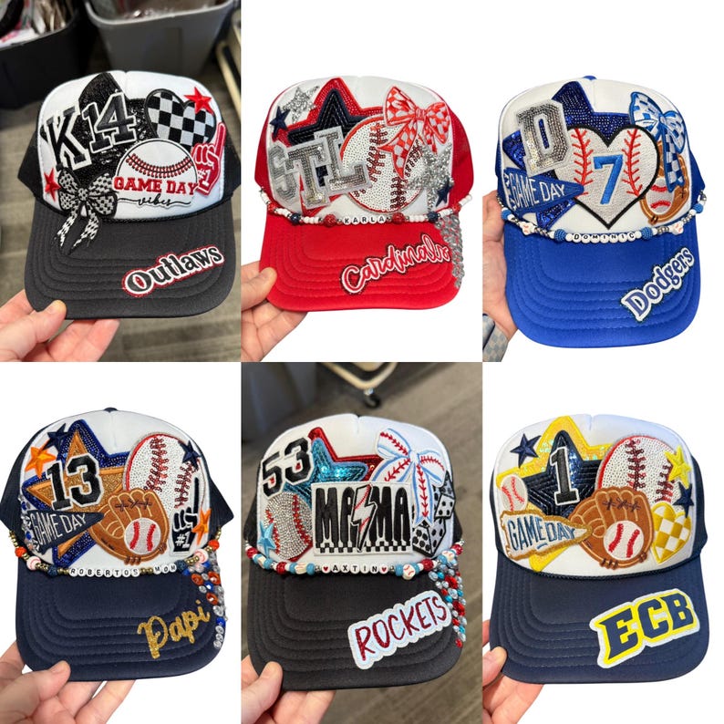 May include: A selection of baseball-themed trucker caps. Each cap has a unique design with text, numbers, and baseball-related embellishments. Colours include black, red, blue, and white. The caps have curved peaks and mesh backs.