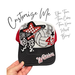 May include: A white and black trucker hat with red mesh back, featuring sequined patches of a volleyball, a checkered star, a bow, and the number 43. The text reads Customize Me, Your Team, Team Colors, Team Name, Mascot, Bling, and Warriors.