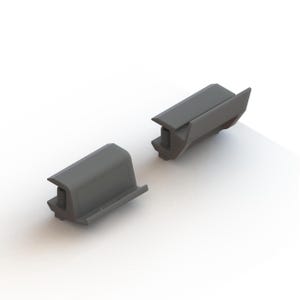 May include: Two grey plastic components, possibly for a mechanical device, are positioned on a white surface. Each piece has a rectangular shape with a curved top and a protruding section with a screw. The components are angled slightly, suggesting they may interlock.