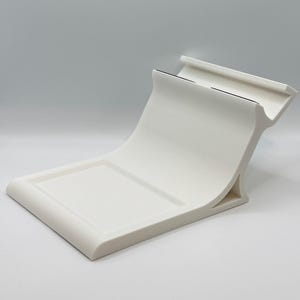 May include: A set of three ceramic mugs with a speckled, matte finish. The mugs are in shades of cream, light gray, and dark gray. Each mug has a simple, minimalist design, perfect for coffee or tea.