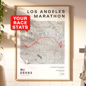 May include: Framed Los Angeles Marathon map print with a red race route overlay. The print includes the text "LOS ANGELES MARATHON" and "03/16/25". Additional details include elevation gain, distance of 26.2 miles, and time.