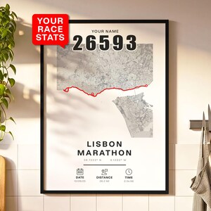 May include: Framed print featuring a map of the Lisbon Marathon course, with a red line highlighting the route. The print includes the text "LISBON MARATHON", race stats, date, distance of 26.2 miles, and time.