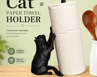 May include: A black cat-shaped paper towel holder with a white paper towel roll. The cat figure is reaching up to hold the roll, which is topped with a small red bird finial. The text reads Cat PAPER TOWEL HOLDER, Functional. Adorable. A charming touch for your kitchen., STURDY & DURABLE, PERFECT GIFT IDEA, PRACTICAL • DECORATIVE • DELIGHTFUL.