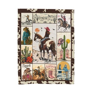 May include: A rectangular blanket featuring a collage of cowgirl illustrations. The images include cowgirls riding horses, cacti, and desert landscapes. The border has a brown and white cowhide pattern. The word "Cowgirls" is visible in one of the images.