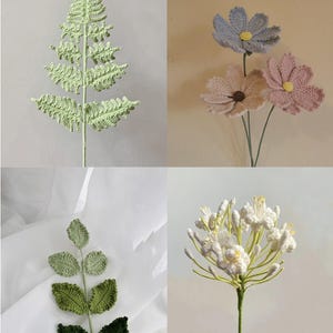 May include: Four crocheted floral stems, two with green leaves and two with white, pink, and blue flowers.