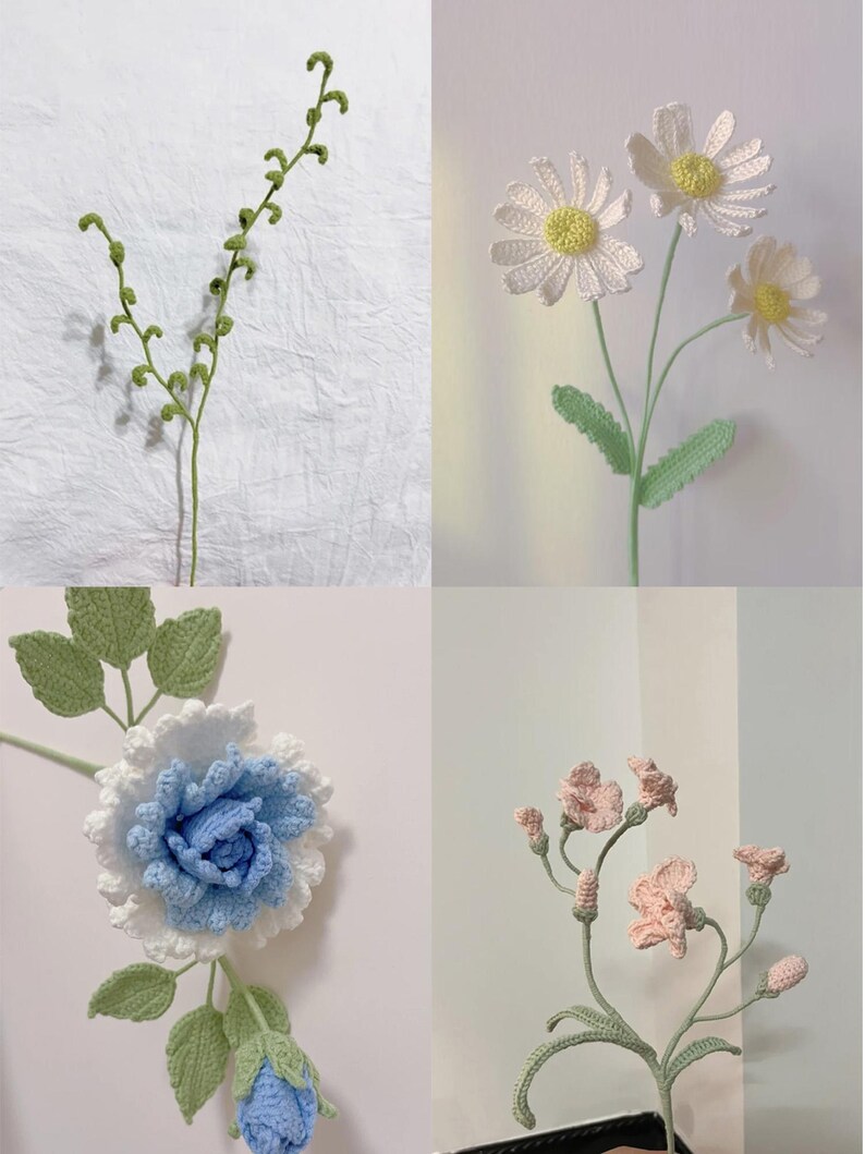 May include: Four crocheted flower stems with green leaves and white, blue, and pink flowers. The flowers are all different types and sizes.