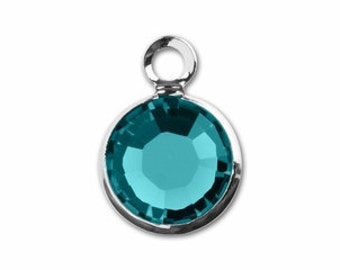 May include: A teal blue crystal charm with a silver loop for attaching to jewellery or other crafts.