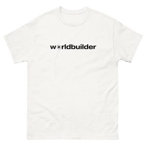 May include: White t-shirt with the word "worldbuilder" printed in black. The word "worldbuilder" is in a sans-serif font. The letter "w" is followed by a star symbol. The t-shirt is made of a thick, durable fabric.