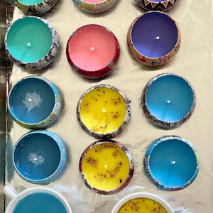 Decorative 4 ounce candle tins with handmade candles,  in a variety of fragrances- soy/beeswax mix