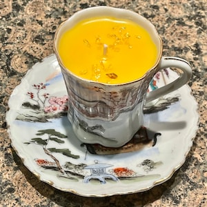 Asian theme tea cup and saucer candle, in passion fruit nectarine fragrance, Embellished with miniature citrine gemstones