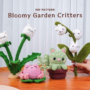 May include: Crocheted "Bloomy Garden Critters" featuring a white cat-faced dandelion, a pink frog, a green cat-faced cactus, and a white cat-faced lily of the valley. The text "PDF PATTERN" and "Bloomy Garden Critters" are visible.