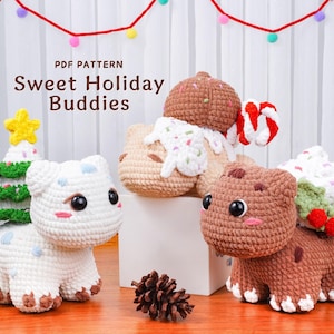 May include: A collection of crocheted holiday-themed figures, including a white cat-like creature, a gingerbread man, and a cookie-shaped character. The figures are decorated with festive details like a Christmas tree, candy cane, and holly. The text "Sweet Holiday Buddies" is visible.