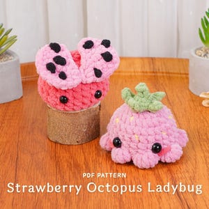 May include: Two handmade crochet plush toys: a ladybug and a strawberry octopus. The ladybug is pink with black spots and sits on a wooden base. The strawberry octopus is pink with a green top and black eyes. The text "Strawberry Octopus Ladybug" is at the bottom.