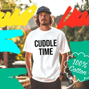 May include: White t-shirt with black text that reads "CUDDLE TIME". A white cloud with black text that reads "100% Cotton" is in the background.